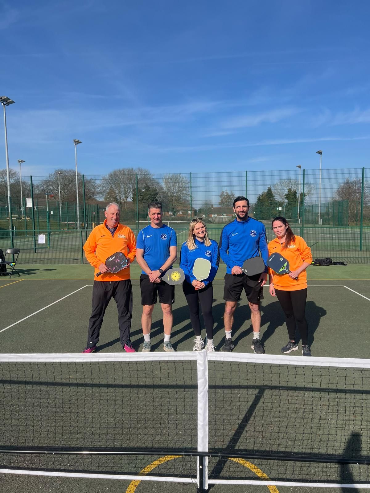 Pickleball team at the net