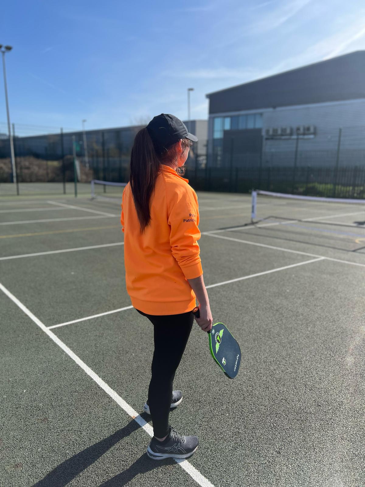 Woman with pickleball paddle